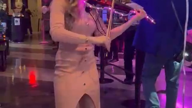Julie Schatz performing violin and piano at a private event
